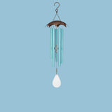 Turquoise wind chime with a white hanging ornament on a white background