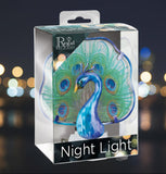 Packaged peacock night light with Regal Lighting logo on a white background