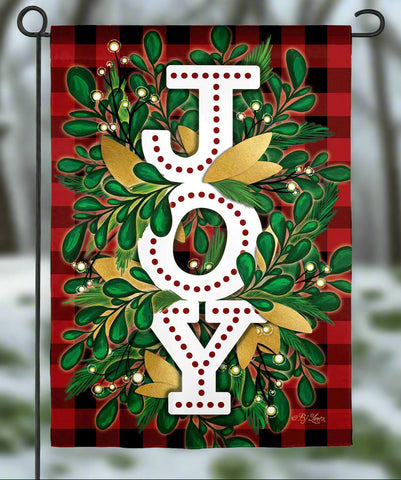 Holiday Joy Burlap Garden Flag featuring bold 'JOY' lettering on a plaid background with foliage accents.