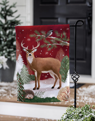 Woodland Storybook Reindeer Burlap Garden Flag featuring a reindeer and snowy landscape, perfect for winter decor.
