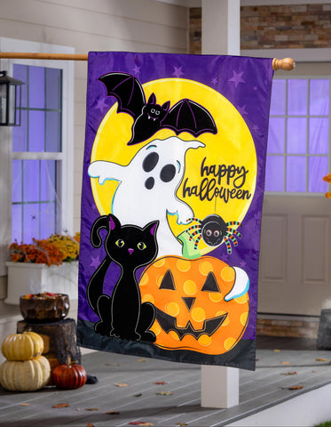 Halloween-themed decorative flag with a ghost, black cat, and pumpkin on a purple background.