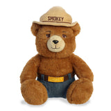 Smokey Bear Plush representing forest conservation dressed in ranger hat and jeans.