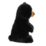 Sitting Pretty American Black Bear Cub Plush profile view showcasing its soft fur and charming features.