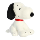 Sitting Snoopy Plush featuring a cute, soft design with a red collar and a huggable form from the Peanuts Collection.
