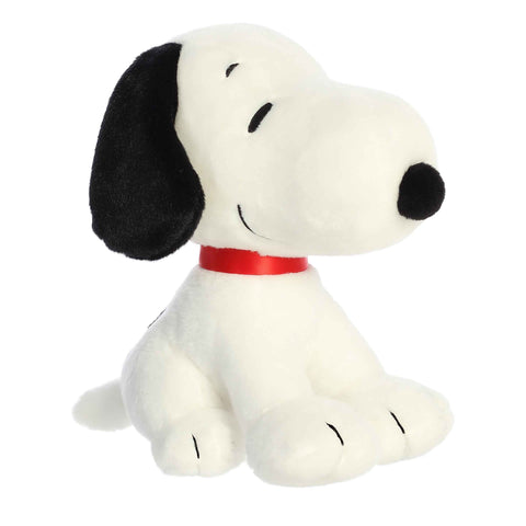 Sitting Snoopy Plush featuring a cute, soft design with a red collar and a huggable form from the Peanuts Collection.