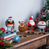 Wobbling Christmas Characters Table Decor featuring Santa, Reindeer, Snowman, and Penguin on a wooden table.