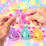 Colorful fish-shaped squishies held by hands with a clear plastic bag of more squishies in the background.