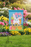Decorative flag with an Easter bunny and eggs on a blue background