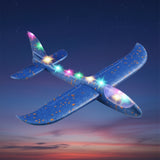 Blue toy airplane with colorful lights on a white background