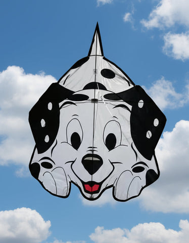 Kite shaped like a dog's face with black spots on a white background