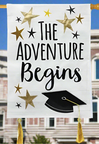 Decorative banner with 'The Adventure Begins' text, stars, and a graduation cap on a white background.